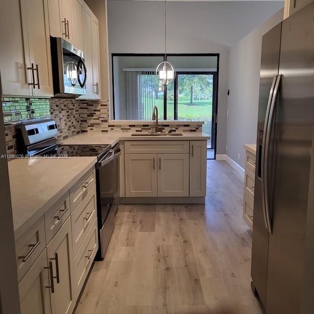 8380 Lords Place, Unit 8380 Boynton Beach, FL 33472 - Photo 5 of 21 a kitchen with a sink stove and refrigerator