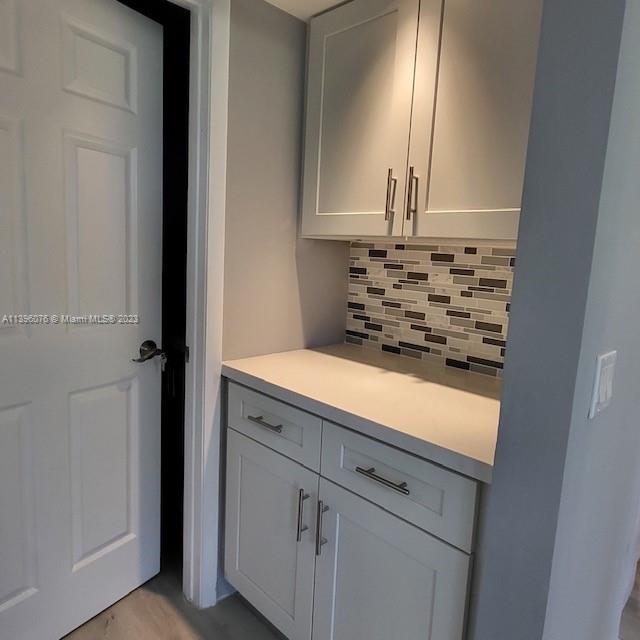 8380 Lords Place, Unit 8380 Boynton Beach, FL 33472 - Photo 6 of 21 a bathroom with a sink and a mirror