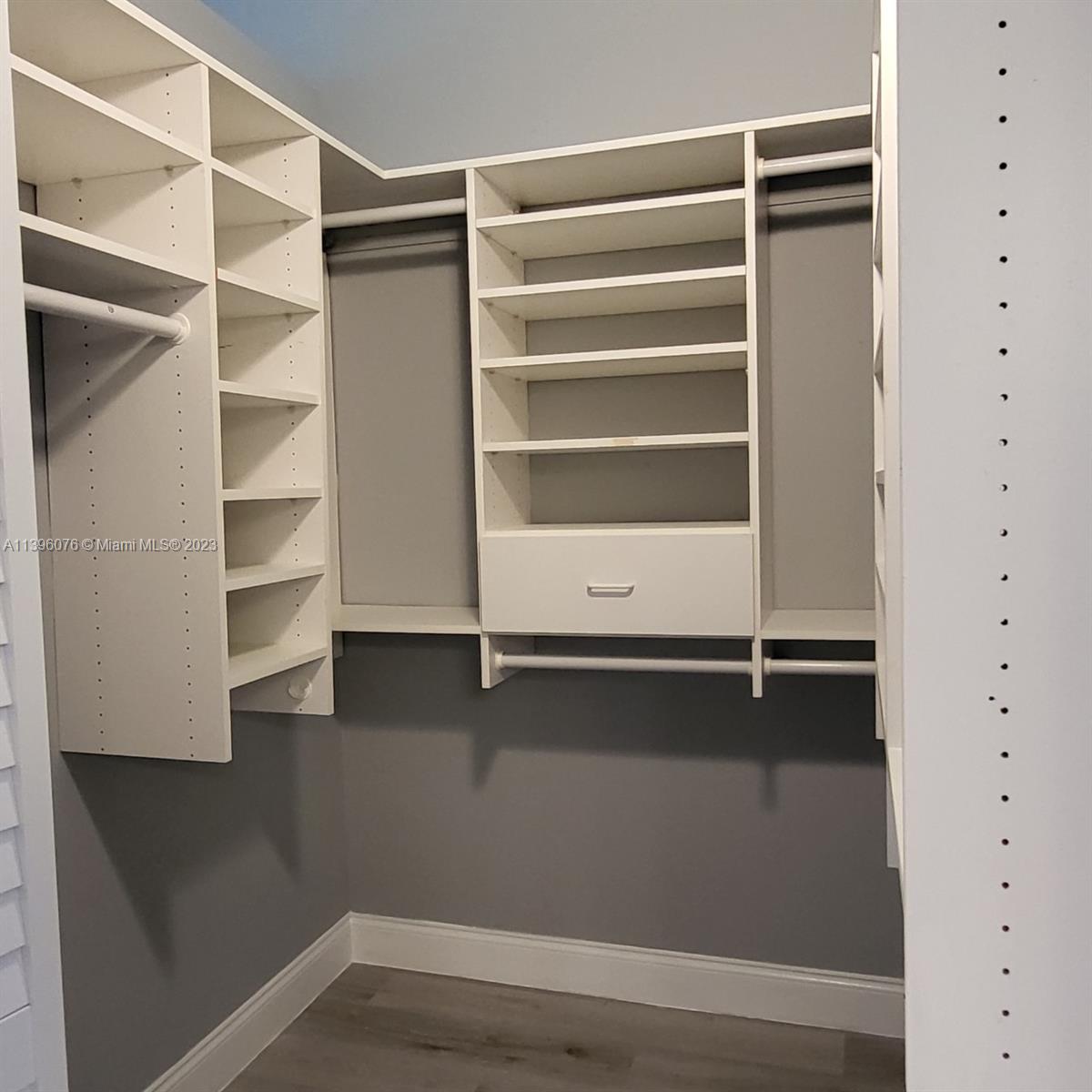 8380 Lords Place, Unit 8380 Boynton Beach, FL 33472 - Photo 10 of 21 a view of an empty walk in closet