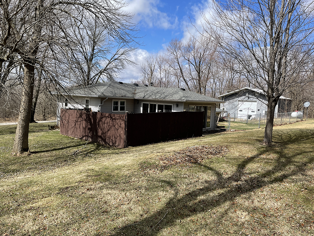 18474 Holly Road Morrison, IL 61270 - Photo 3 of 45 a view of a house with a yard covered in snow