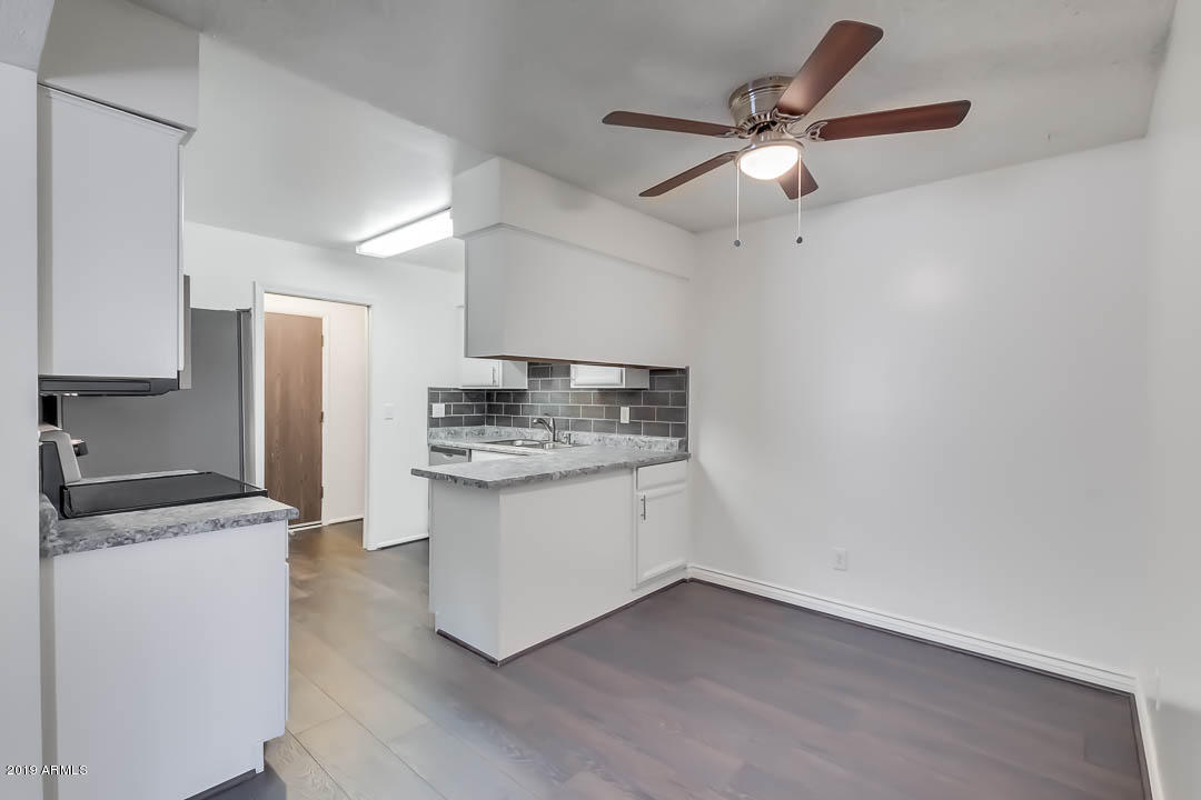 1860 East Inverness Avenue Mesa, AZ 85204 - Photo 11 of 29 a kitchen with a sink cabinets and stainless steel appliances