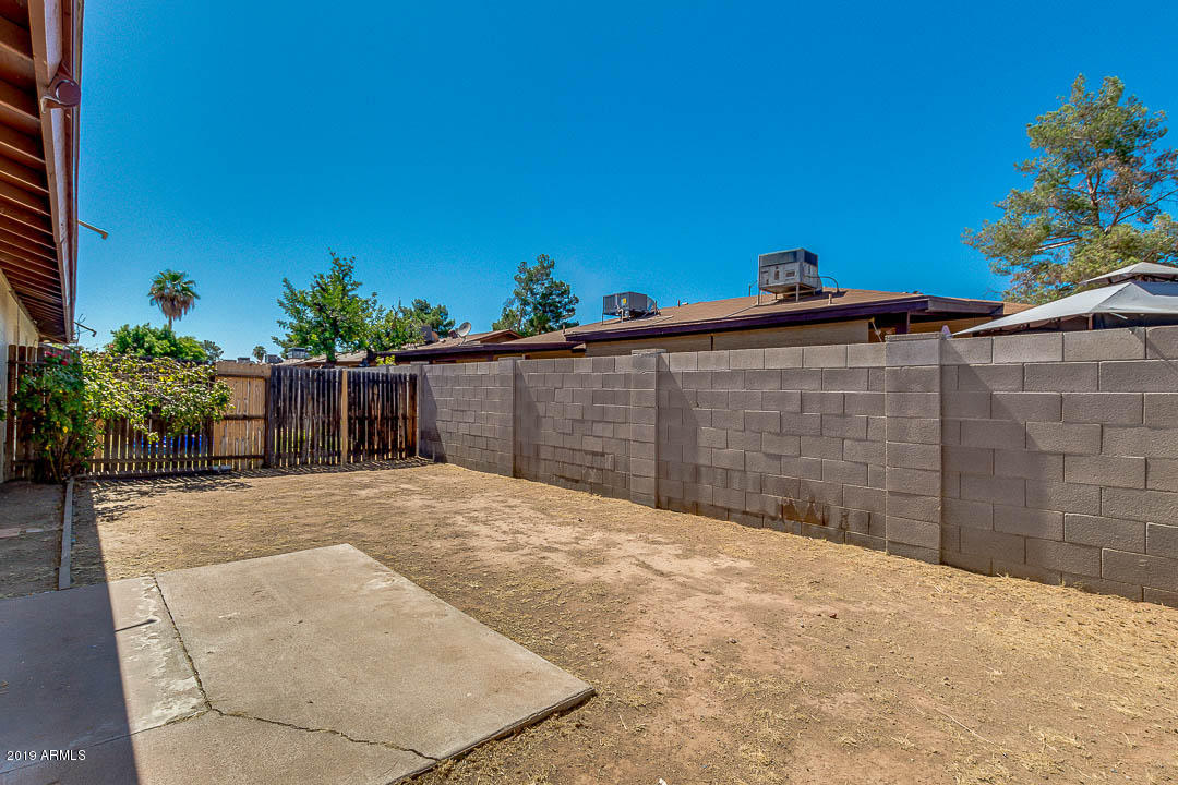 1860 East Inverness Avenue Mesa, AZ 85204 - Photo 29 of 29 a view of wooden floor in front of a building