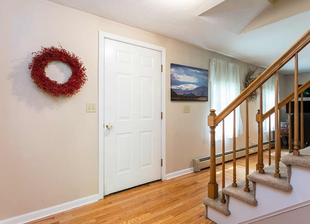105 Warren Road Townsend, MA 01469 - Photo 14 of 37 a view of entryway and hall with wooden floor