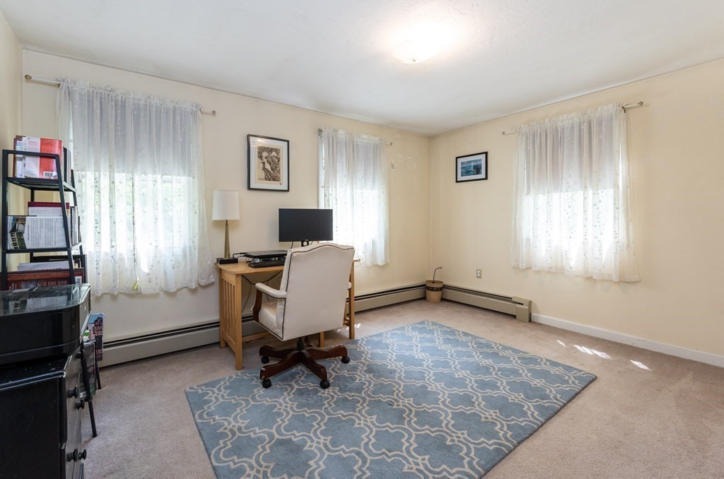 105 Warren Road Townsend, MA 01469 - Photo 15 of 37 a view of a workspace with furniture and a window