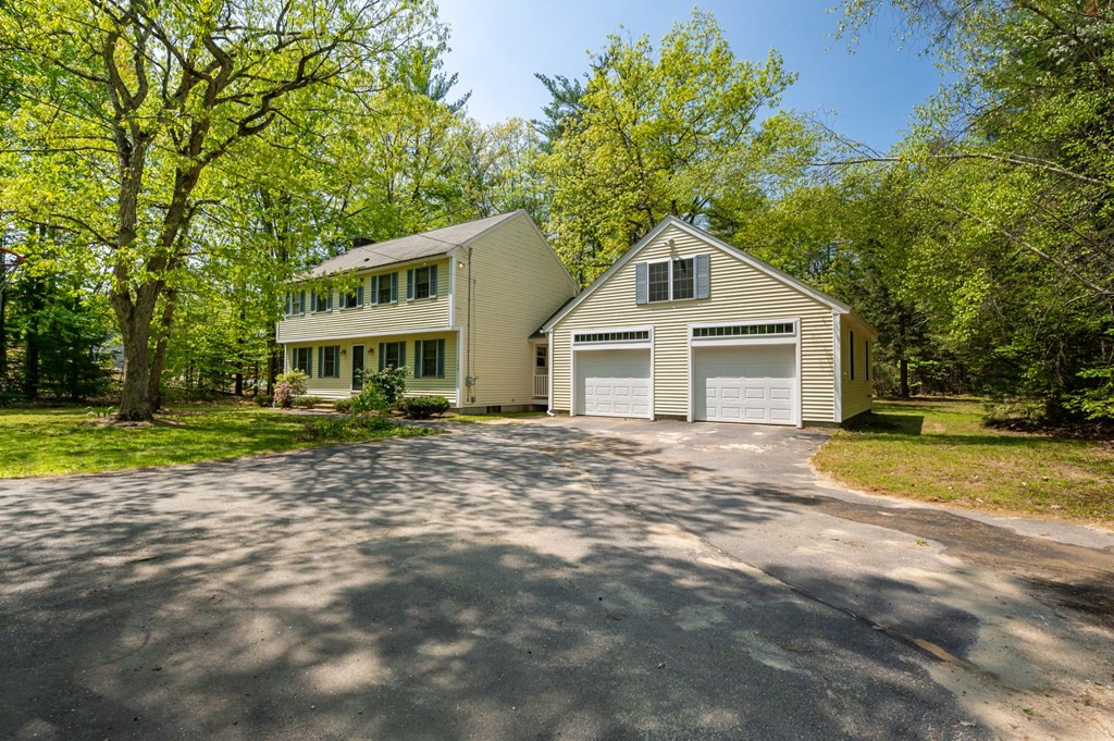 105 Warren Road Townsend, MA 01469 - Photo 2 of 37 a front view of a house with a yard