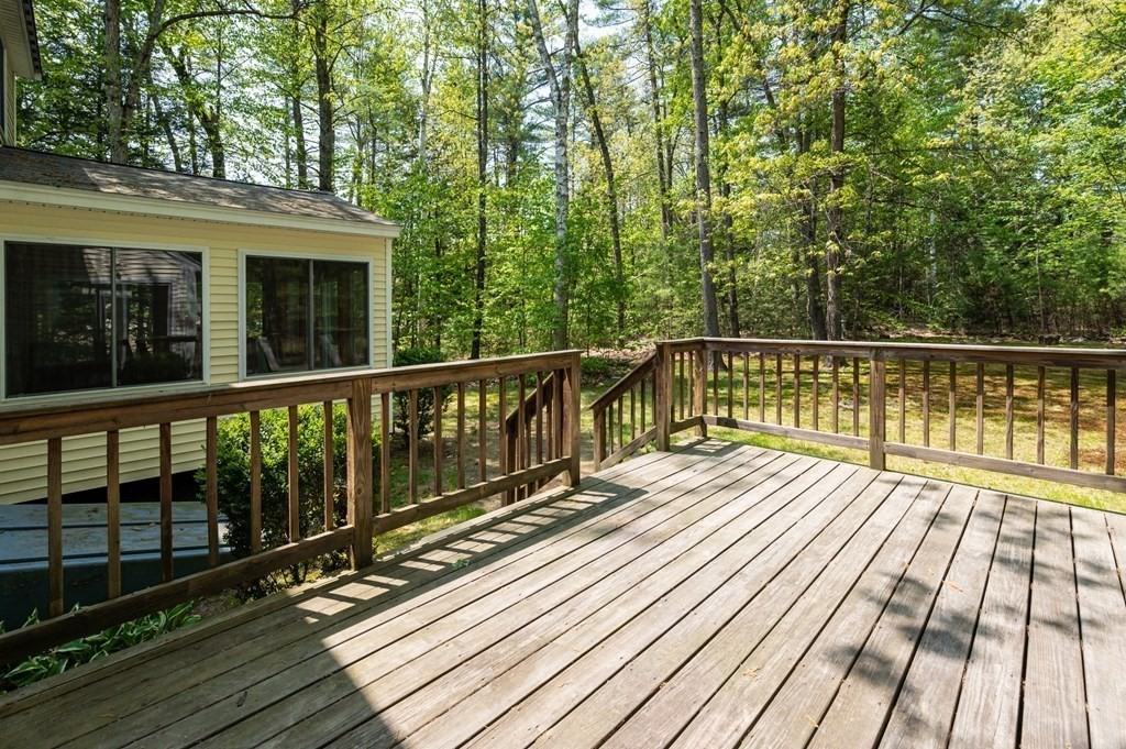 105 Warren Road Townsend, MA 01469 - Photo 27 of 37 a view of balcony with wooden floor and fence