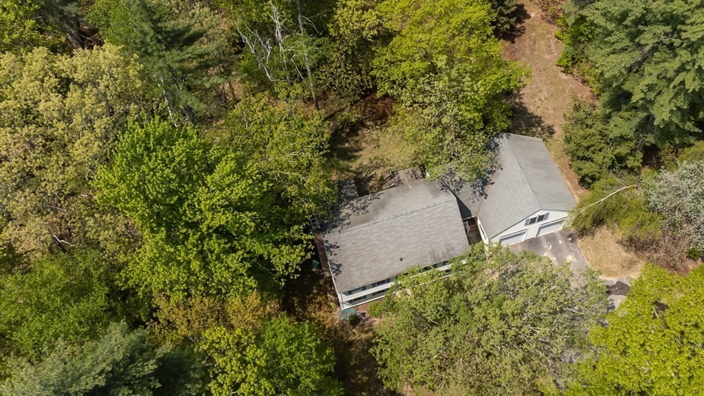 105 Warren Road Townsend, MA 01469 - Photo 32 of 37 a backyard of a house with lots of green space