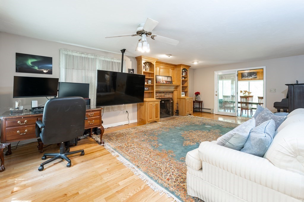 105 Warren Road Townsend, MA 01469 - Photo 9 of 37 a living room with furniture and a flat screen tv
