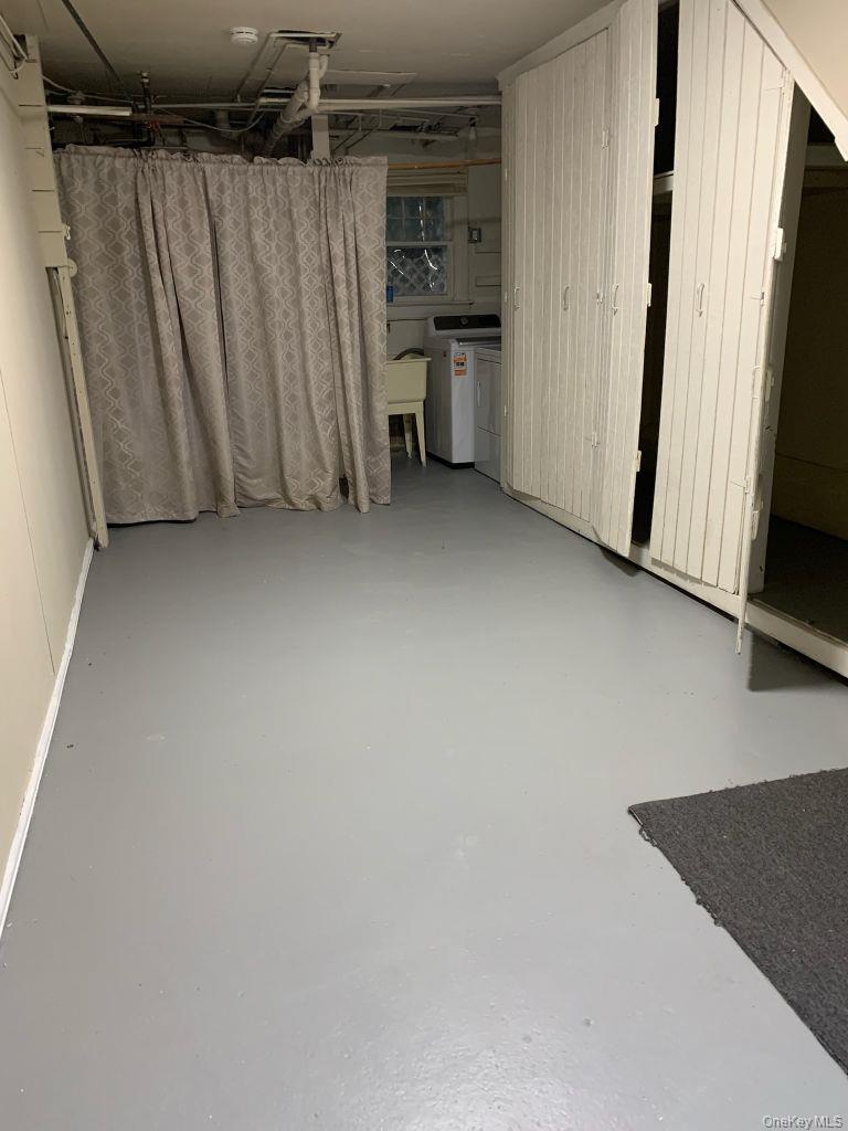 12 Forest Row Great Neck, NY 11023 - Photo 4 of 4 a view of a storage & utility room with a refrigerator