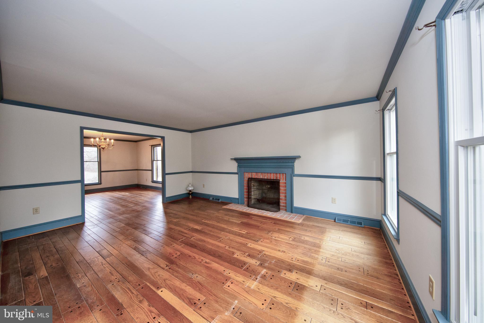 3044 Level Road Churchville, MD 21028 - Photo 12 of 52 a view of empty room with wooden floor and fireplace