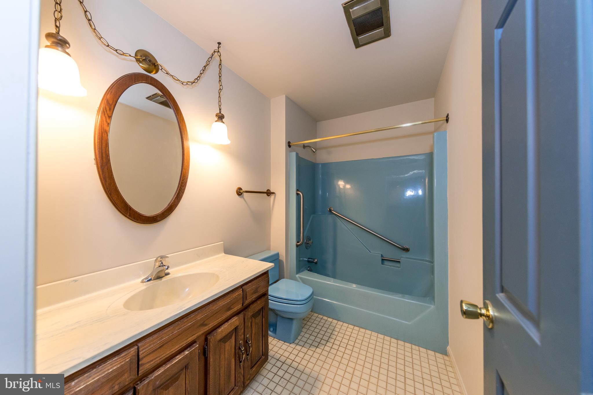 3044 Level Road Churchville, MD 21028 - Photo 23 of 52 a bathroom with a granite countertop sink toilet and a mirror