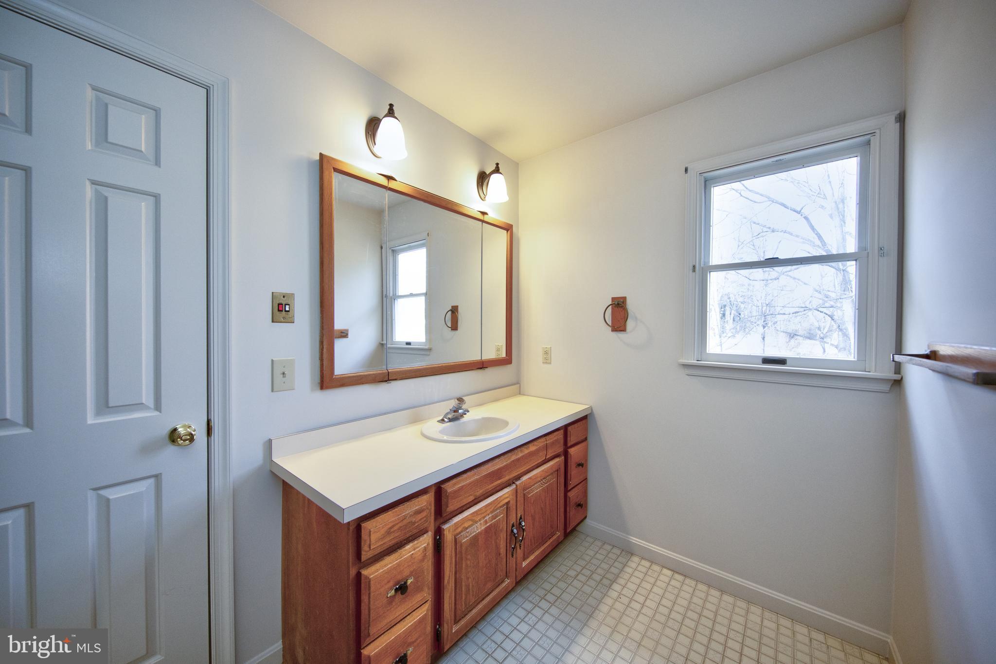 3044 Level Road Churchville, MD 21028 - Photo 30 of 52 a bathroom with a sink a vanity and a mirror