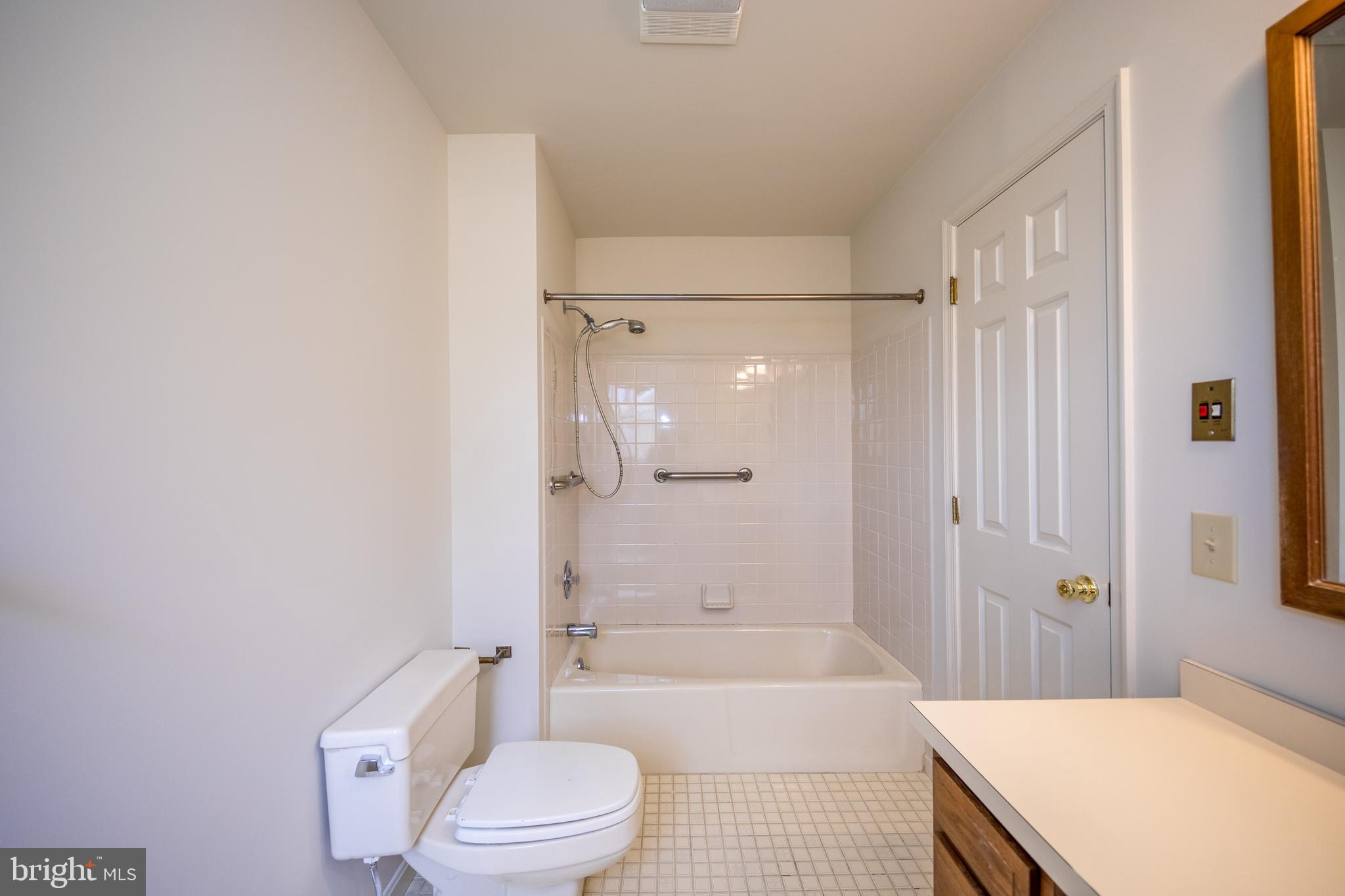 3044 Level Road Churchville, MD 21028 - Photo 31 of 52 a bathroom with a granite countertop bathtub shower sink vanity and toilet