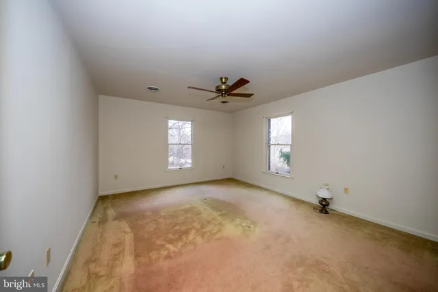 a view of an empty room and window