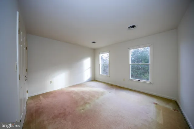 an empty room with windows