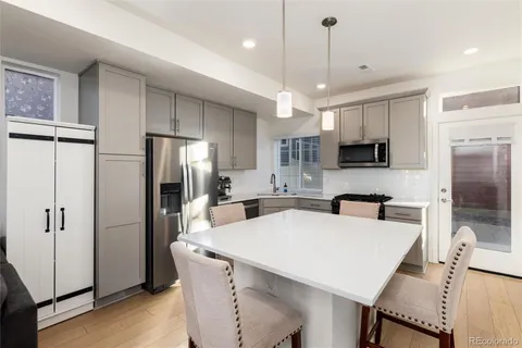 a bathroom with a sink a mirror and vanity