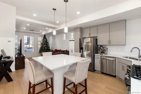 a bathroom with a double vanity sink toilet mirror and shower