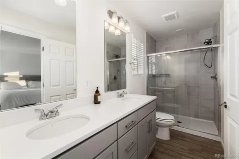 a living room with furniture large window and flat screen tv