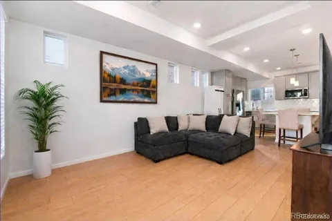 a kitchen with stainless steel appliances a refrigerator sink microwave and cabinets