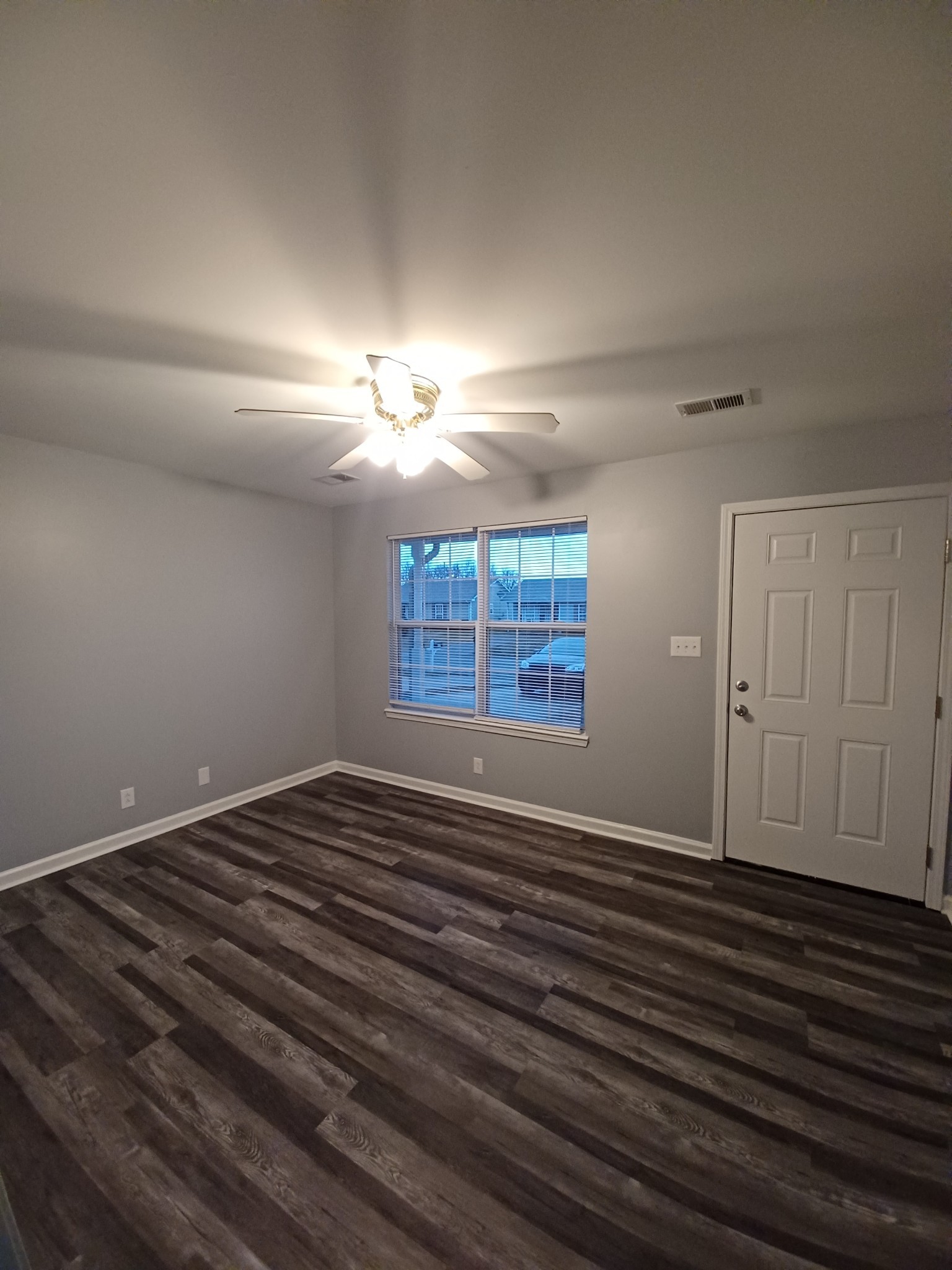 1039 Shadow Ridge Avenue Oak Grove, KY 42262 - Photo 2 of 16 a view of an empty room with wooden floor and a window