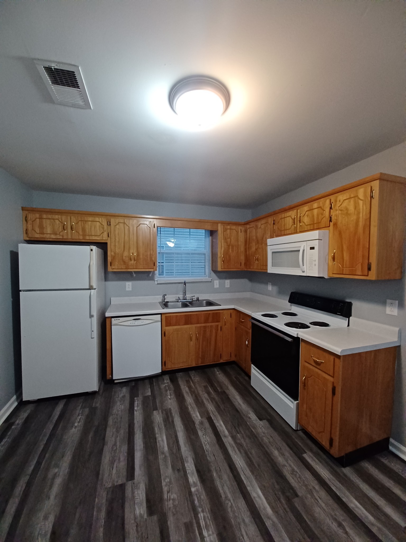1039 Shadow Ridge Avenue Oak Grove, KY 42262 - Photo 3 of 16 a kitchen with stainless steel appliances granite countertop a stove and a sink