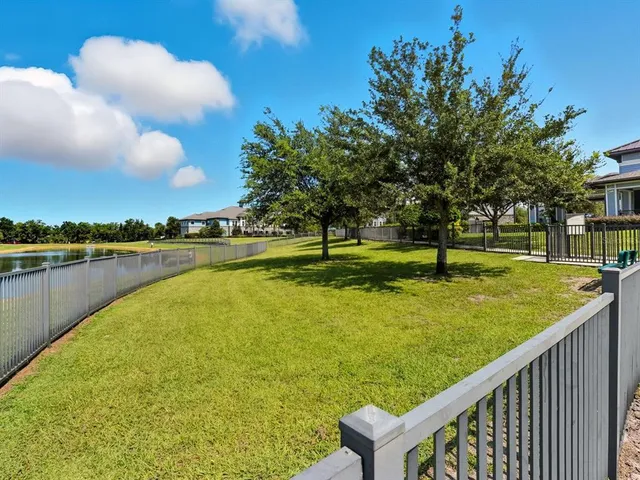 a view of a lake with a yard