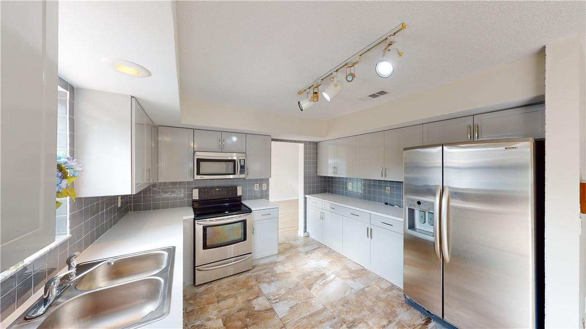 Undisclosed Address Miramar, FL 33025 - Photo 11 of 33 Another kitchen view