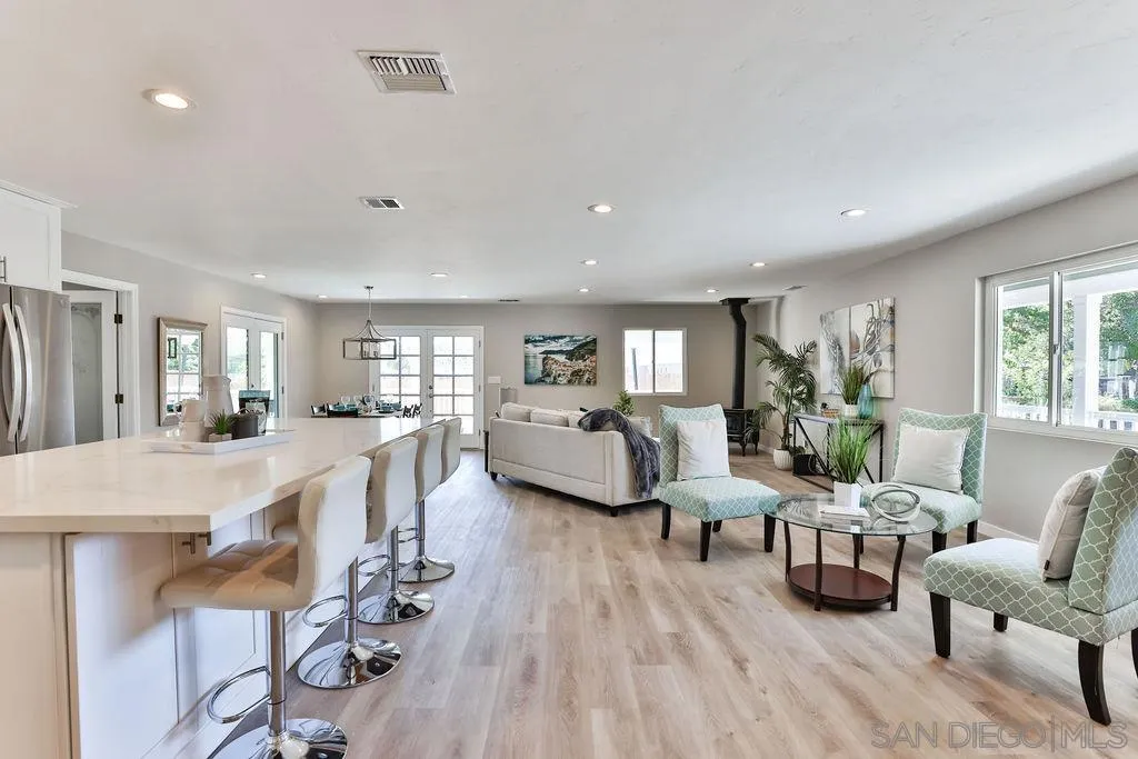 9802 Sierra Madre Road Spring Valley, CA 91977 - Photo 15 of 48 a living room with furniture and a wooden floor