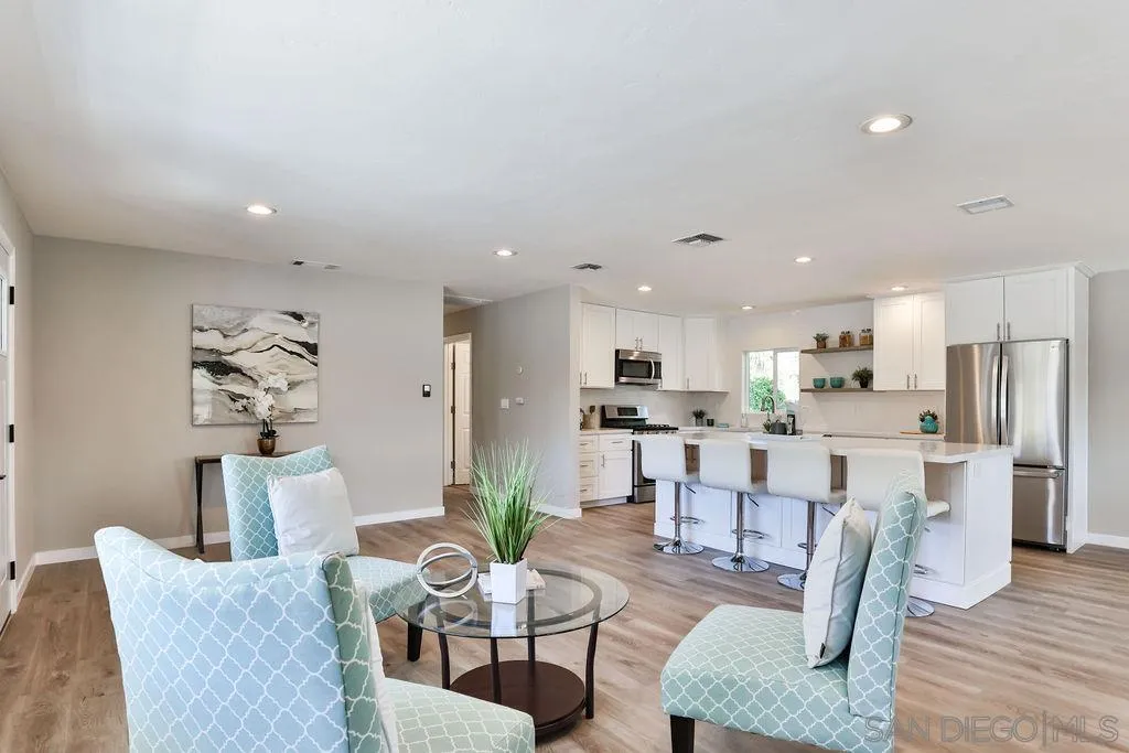 9802 Sierra Madre Road Spring Valley, CA 91977 - Photo 18 of 48 a living room with furniture dining table and wooden floor