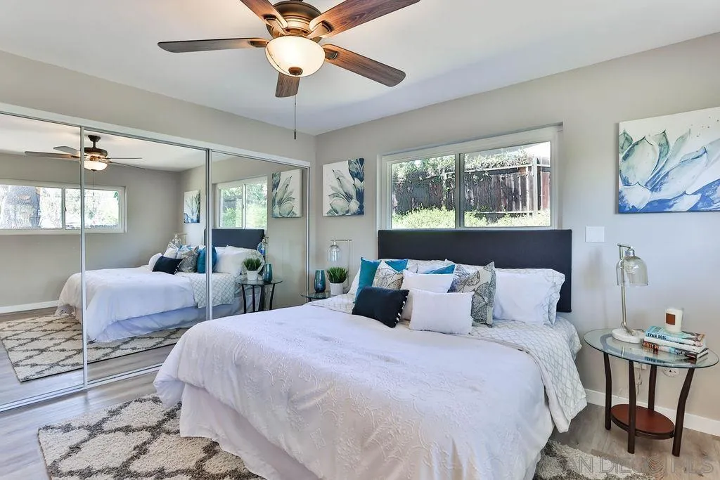 9802 Sierra Madre Road Spring Valley, CA 91977 - Photo 20 of 48 a bedroom with beds and a chandelier
