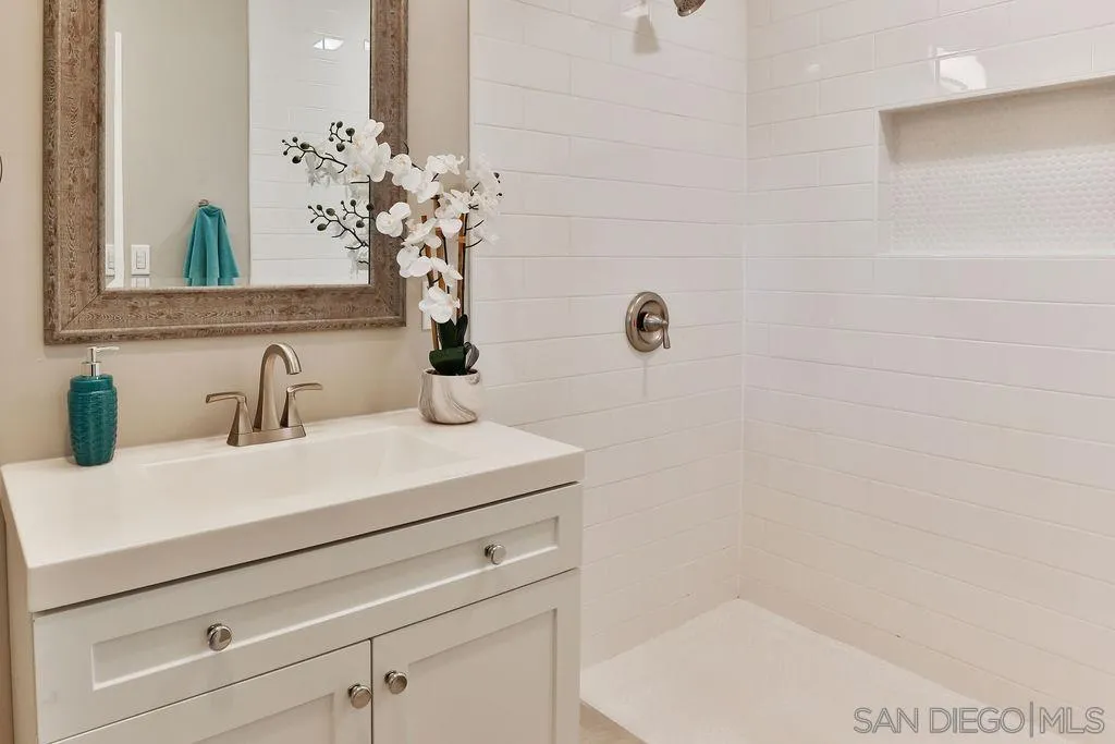 9802 Sierra Madre Road Spring Valley, CA 91977 - Photo 23 of 48 a bathroom with a sink and a mirror