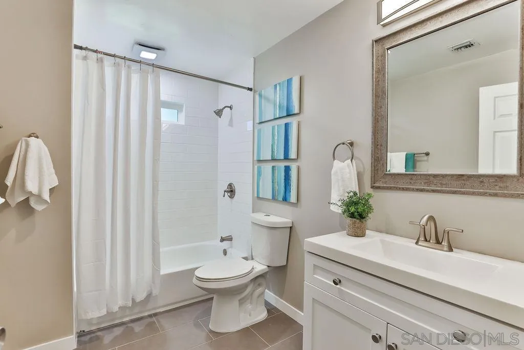 9802 Sierra Madre Road Spring Valley, CA 91977 - Photo 26 of 48 a bathroom with a sink a toilet and shower