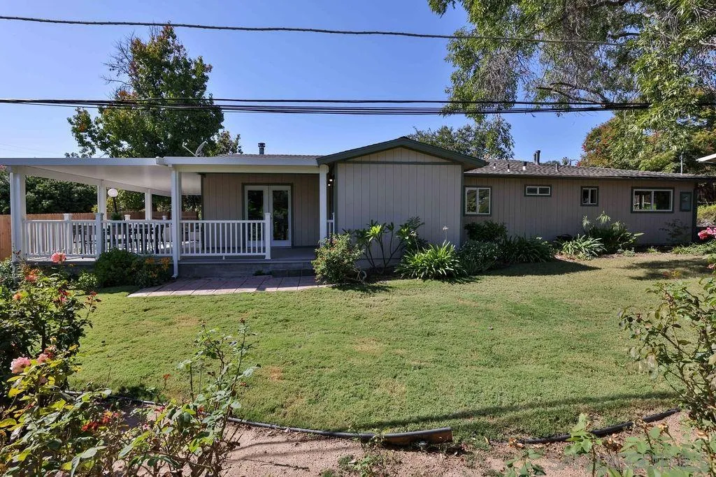 9802 Sierra Madre Road Spring Valley, CA 91977 - Photo 28 of 48 a view of a house with backyard and garden