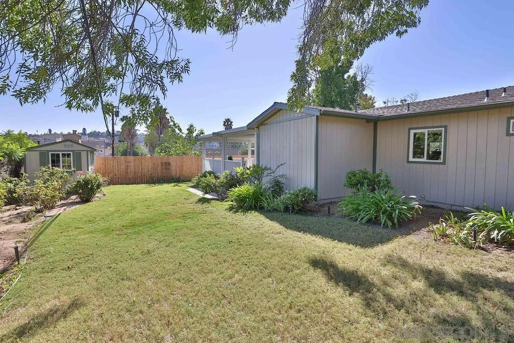 9802 Sierra Madre Road Spring Valley, CA 91977 - Photo 31 of 48 a front view of a house with garden