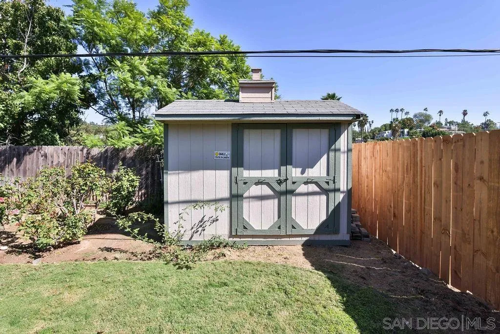 9802 Sierra Madre Road Spring Valley, CA 91977 - Photo 33 of 48 a front view of a house with garden