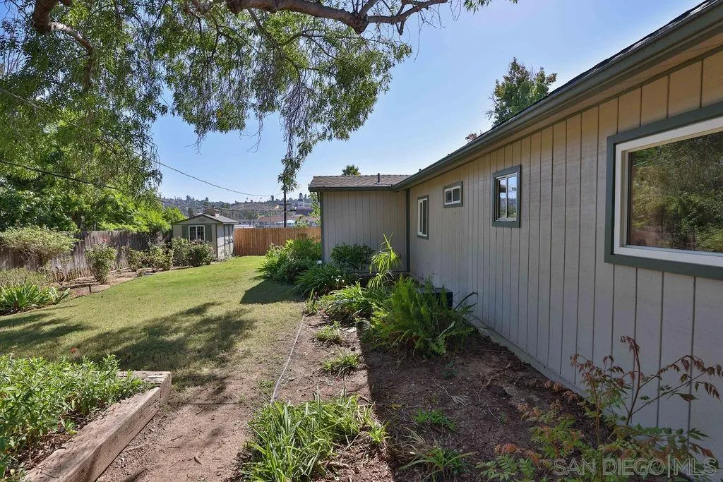 9802 Sierra Madre Road Spring Valley, CA 91977 - Photo 35 of 48 a front view of house with yard and trees