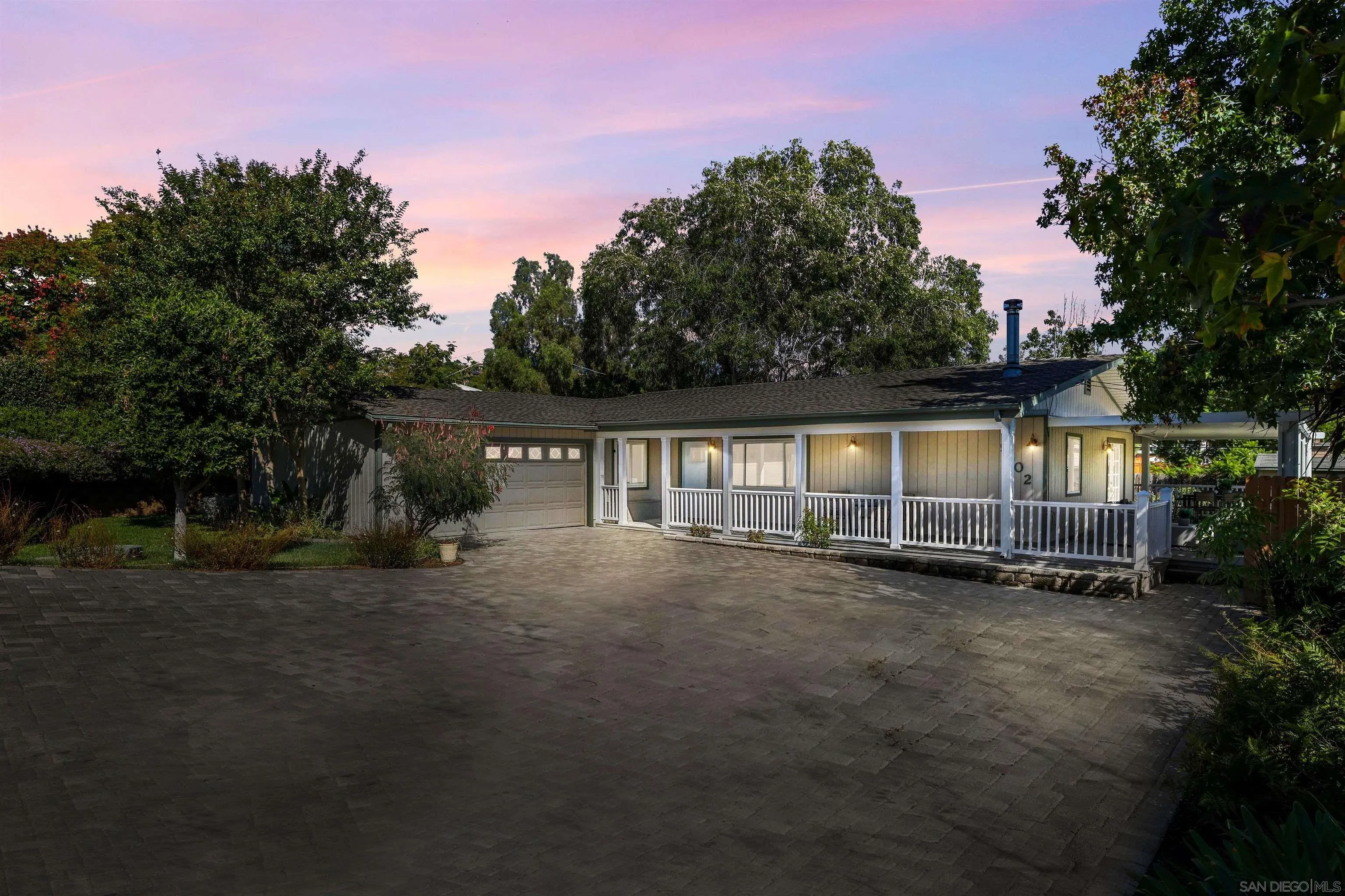 9802 Sierra Madre Road Spring Valley, CA 91977 - Photo 44 of 48 a view of a house with a yard next to a road