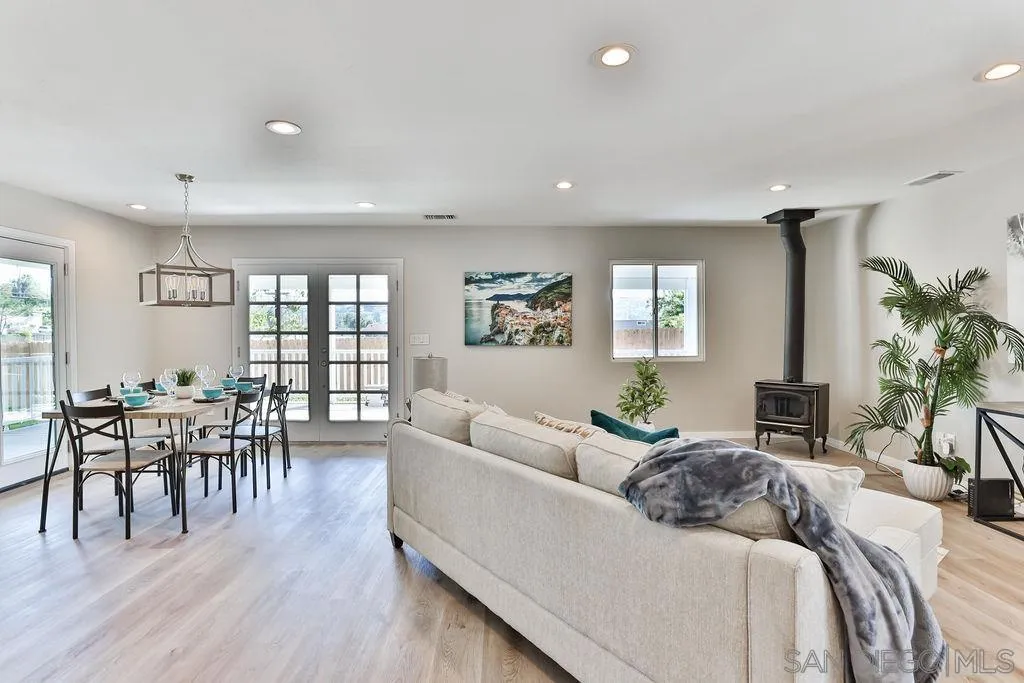 9802 Sierra Madre Road Spring Valley, CA 91977 - Photo 7 of 48 a living room with furniture and a wooden floor