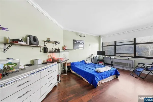 a living room with furniture and flat screen tv