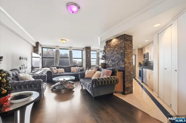 a living room with furniture and a large window