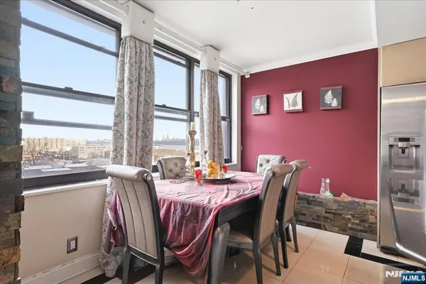 a dining room with furniture and window