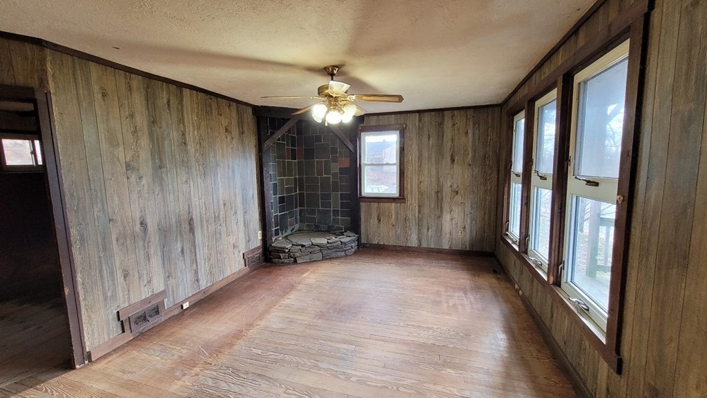 136 Main Road Westfield, MA 01085 - Photo 3 of 13 wooden floor in an empty room with a window