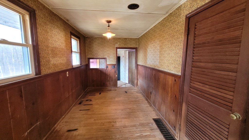 136 Main Road Westfield, MA 01085 - Photo 4 of 13 a view of a hallway with wooden floor and staircase