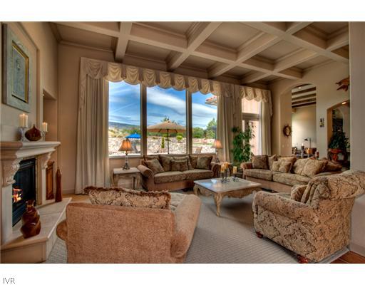 12805 Silver Wolf Road Reno, NV 89511 - Photo 4 of 9 a living room with furniture a large window and a fireplace