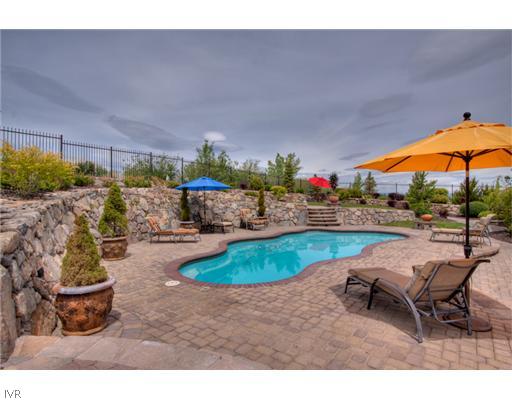 12805 Silver Wolf Road Reno, NV 89511 - Photo 7 of 9 a backyard of a house with yard and outdoor seating