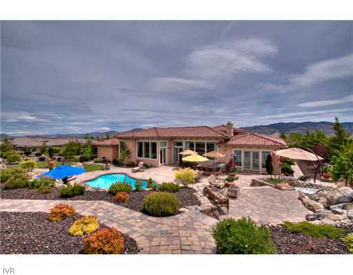 12805 Silver Wolf Road Reno, NV 89511 - Photo 8 of 9 a view of a big house with swimming pool and outdoor seating