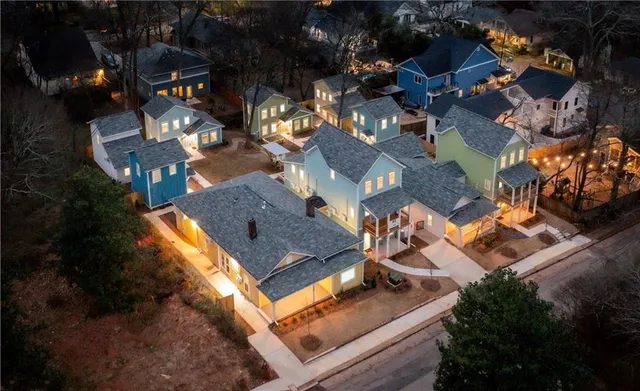 an aerial view of residential houses with outdoor space