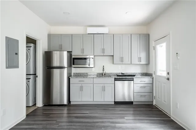a kitchen with stainless steel appliances a refrigerator and a stove
