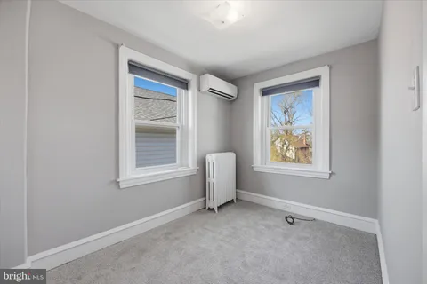a view of room with window and ceiling fan