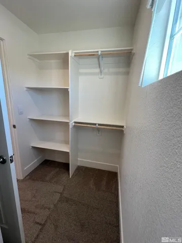 a view of an empty walk in closet